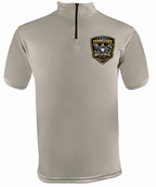 A short-sleeve quarter-zip performance shirt in light beige, featuring a black zipper at the mock neck and a 'Tennessee Golf & Coffee' shield logo on the left chest.
